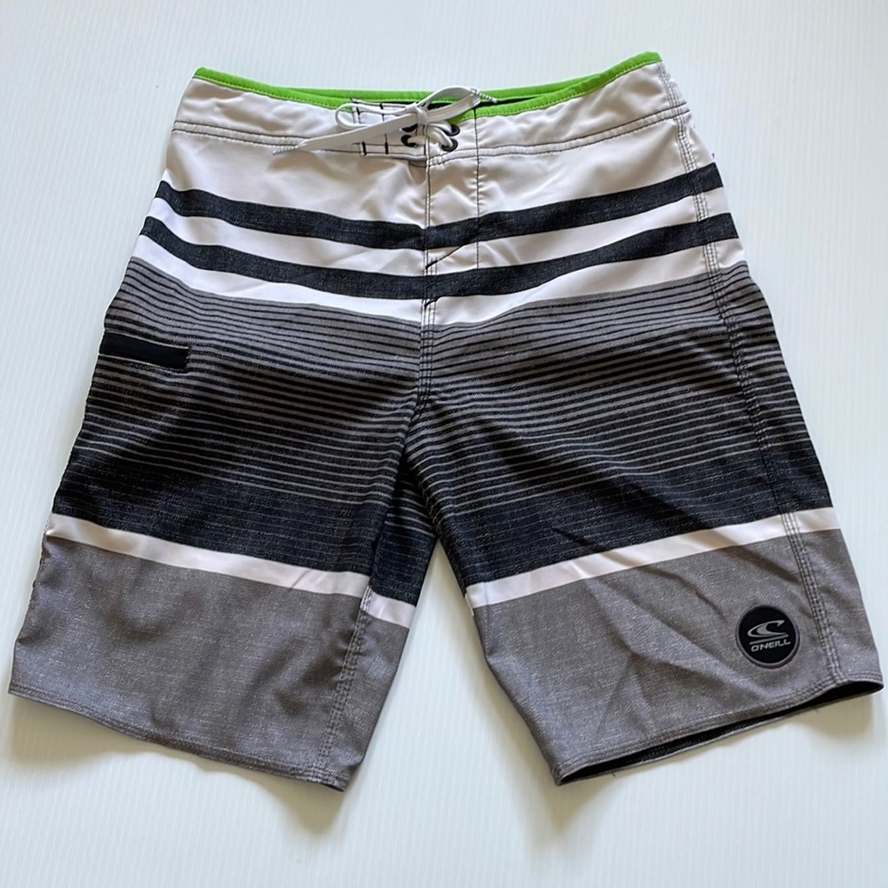 O’NEILL hyper freak black, white & gray board shorts.  Size 27